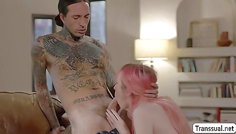 A hot busty shemale with red hair is screwed by a boyfriend