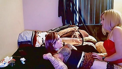 Playful blonde girl in dress plays with her man's prick