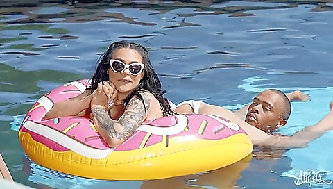 A hot girl with a tattooed pussy is being filmed by a stranger