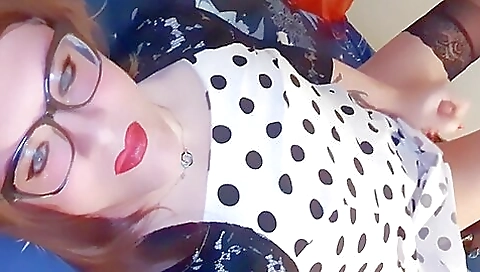 Red-haired woman is masturbating on the bed in bed