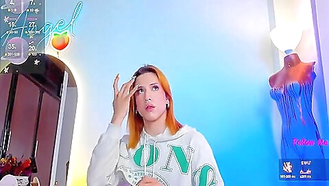 Beautiful redhead wearing sexy lingerie enjoys herself